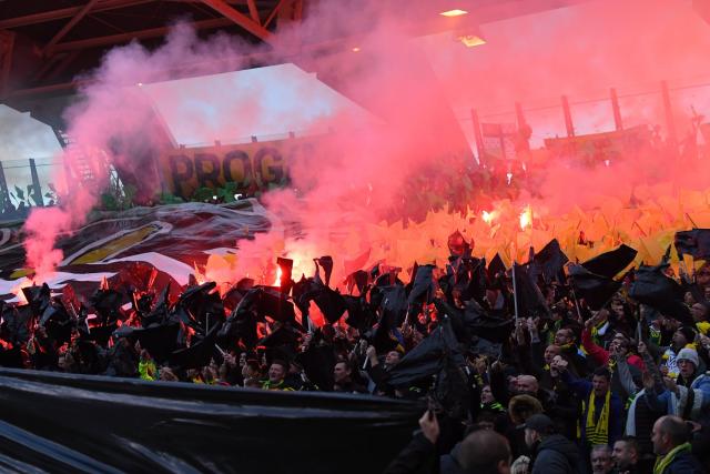 French league 1 match halted by pitch invasions and smoke bombs at nantes