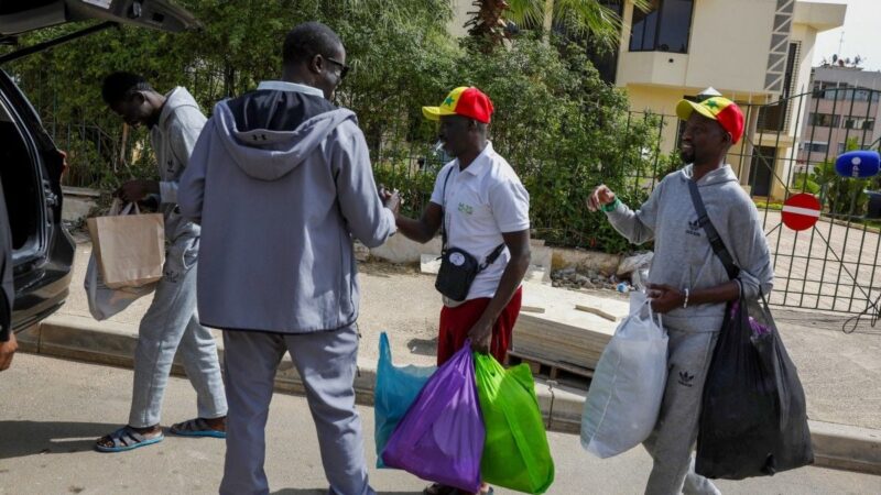Three released senegalese fans return home after can incident