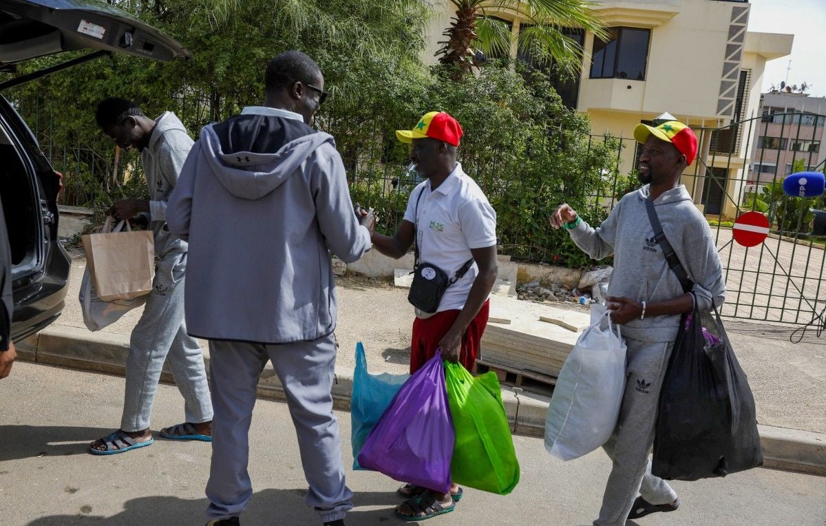 Three released senegalese fans return home after can incident