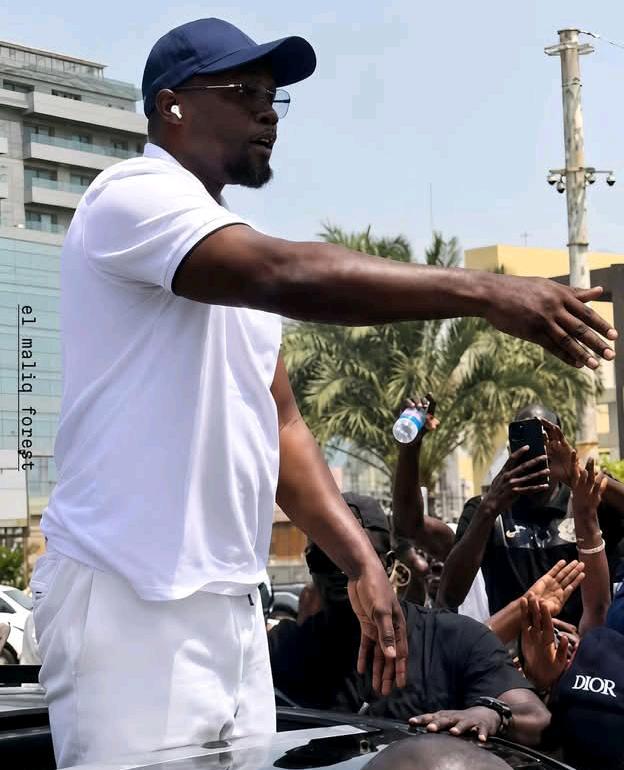 Enthusiastic supporters greet prime minister ousmane sonko during Dakar march
