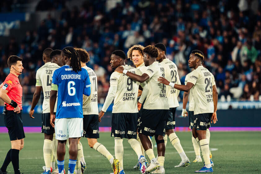 Action shot of AS Monaco players in a Ligue 1 match against Strasbourg