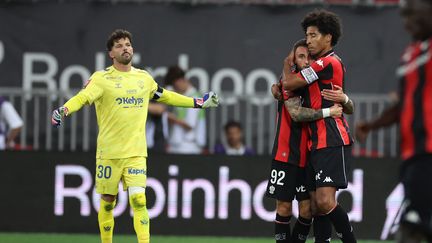 Jonathan Clauss and Dante celebrating Nice's playoff victory against Saint-Etienne