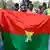 Burkina Faso supporters wave homemade AES flags (January 2024 archive)