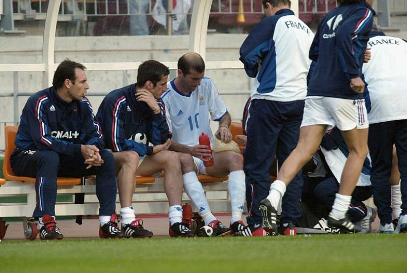 Zinedine zidane limping off with a thigh injury against south korea