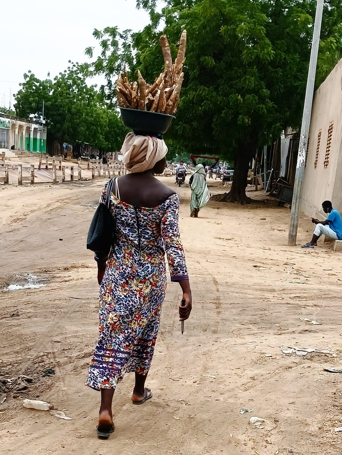 Léa sells cassava during break to finance schooling in N’Djamena