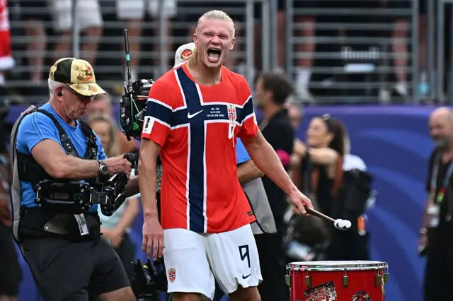 Norwegian striker Erling Braut Haaland plays a drum as he celebrates after winning the 2026 World Cup Round of 16 match between Brazil and Norway at the New York/New Jersey stadium in East Rutherford on July 5, 2026.
